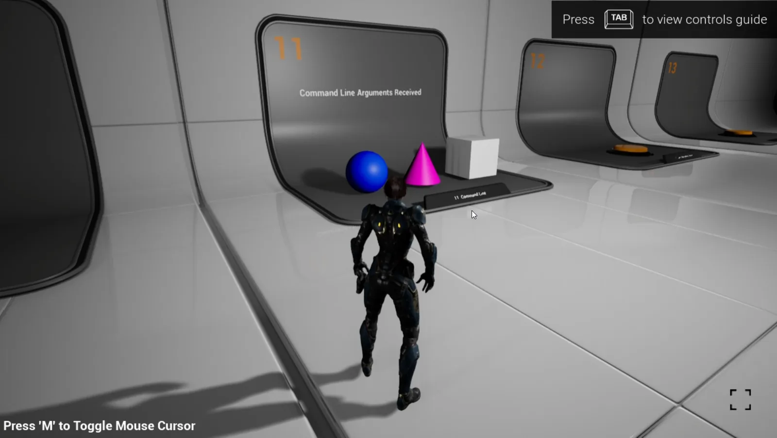 The demo at booth 11 with a blue ball and a pink cone, the box still white
